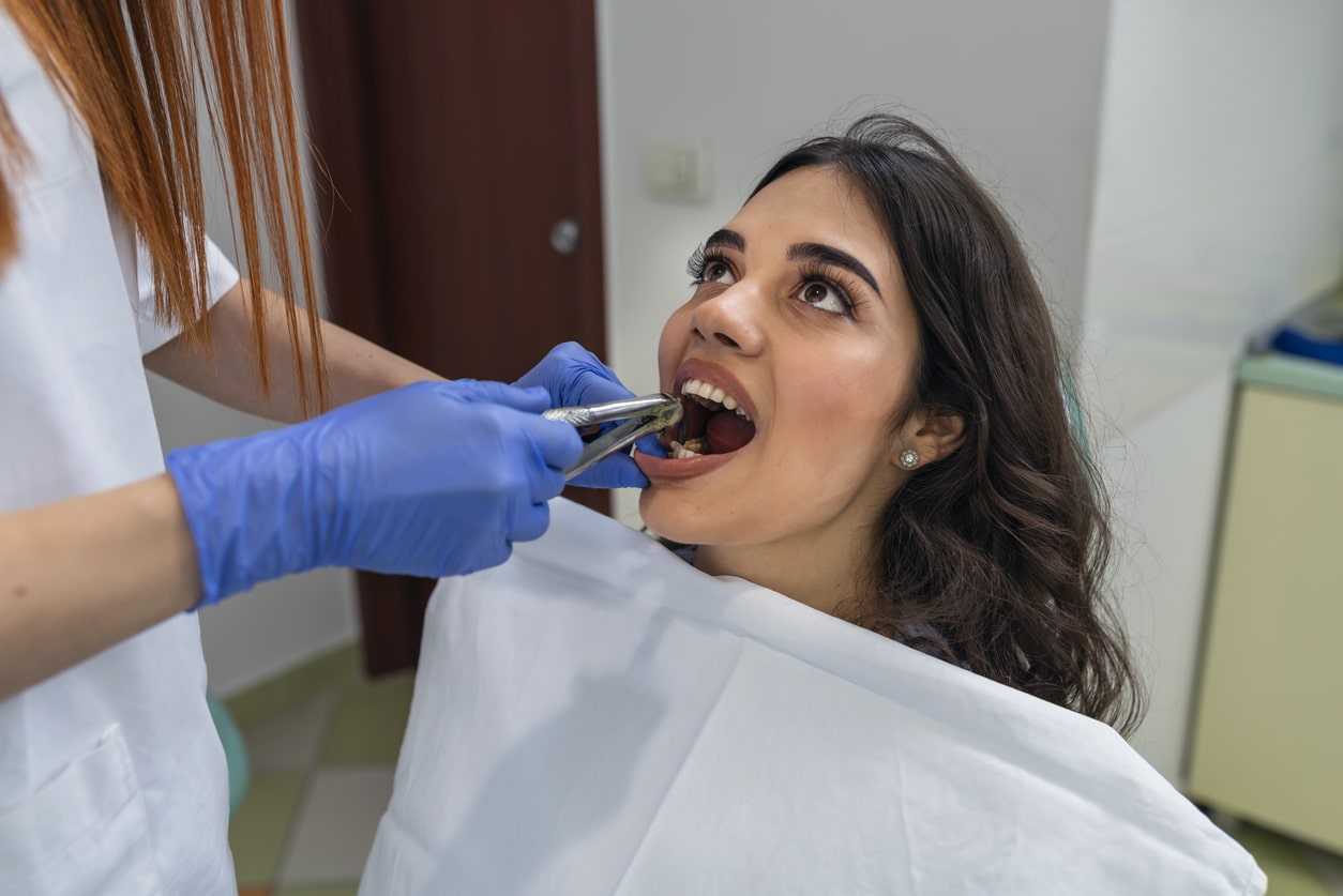 a woman brushing her teeth