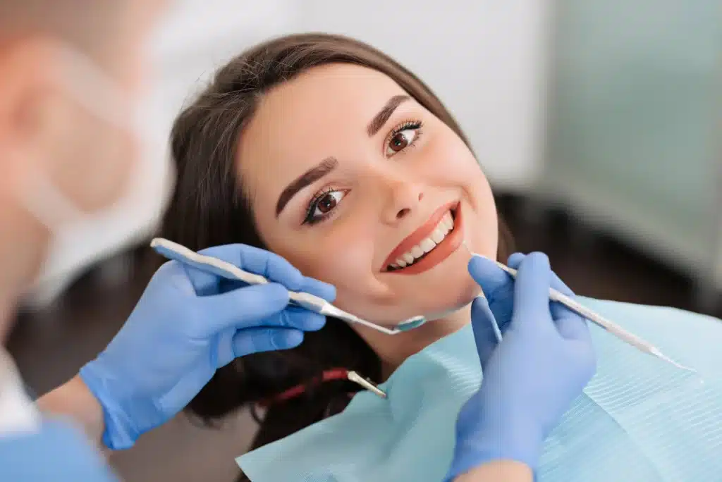 Woman undergoing treatment by a dentist in brownstown