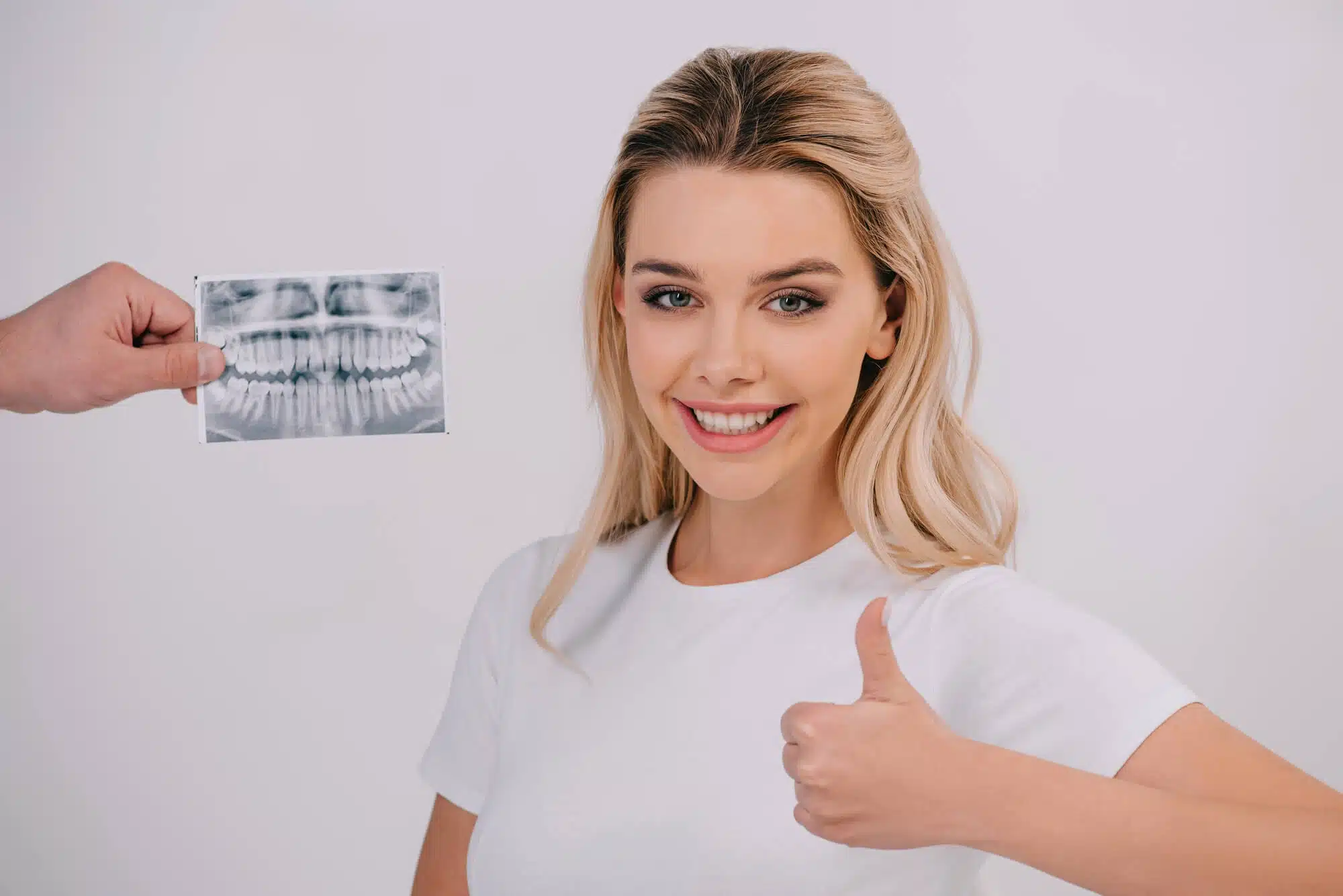 Girl with her healthy teeth after going to a dentist in woodhaven mi