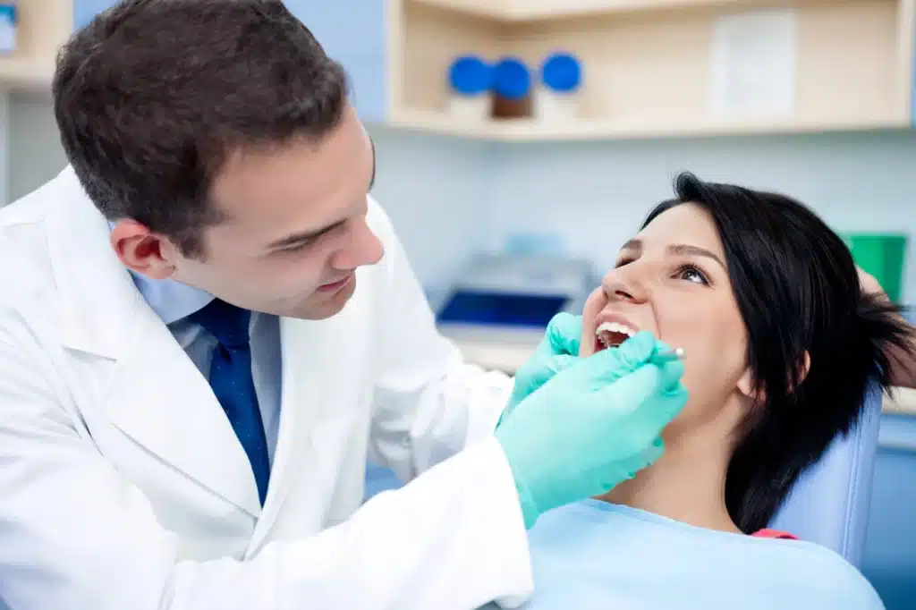 Girl's teeth examined by a dentist in woodhaven mi