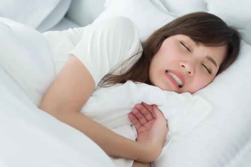 Girl showing signs of bruxism needs to visit dental office brownstown