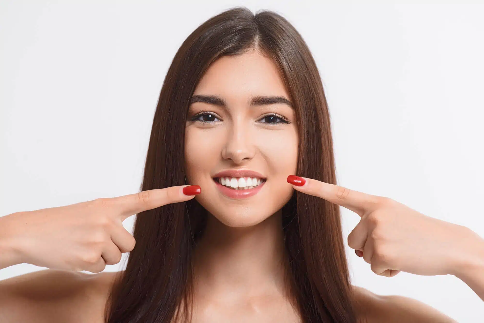 Girl showing her teeth after treatment at dental office brownstown