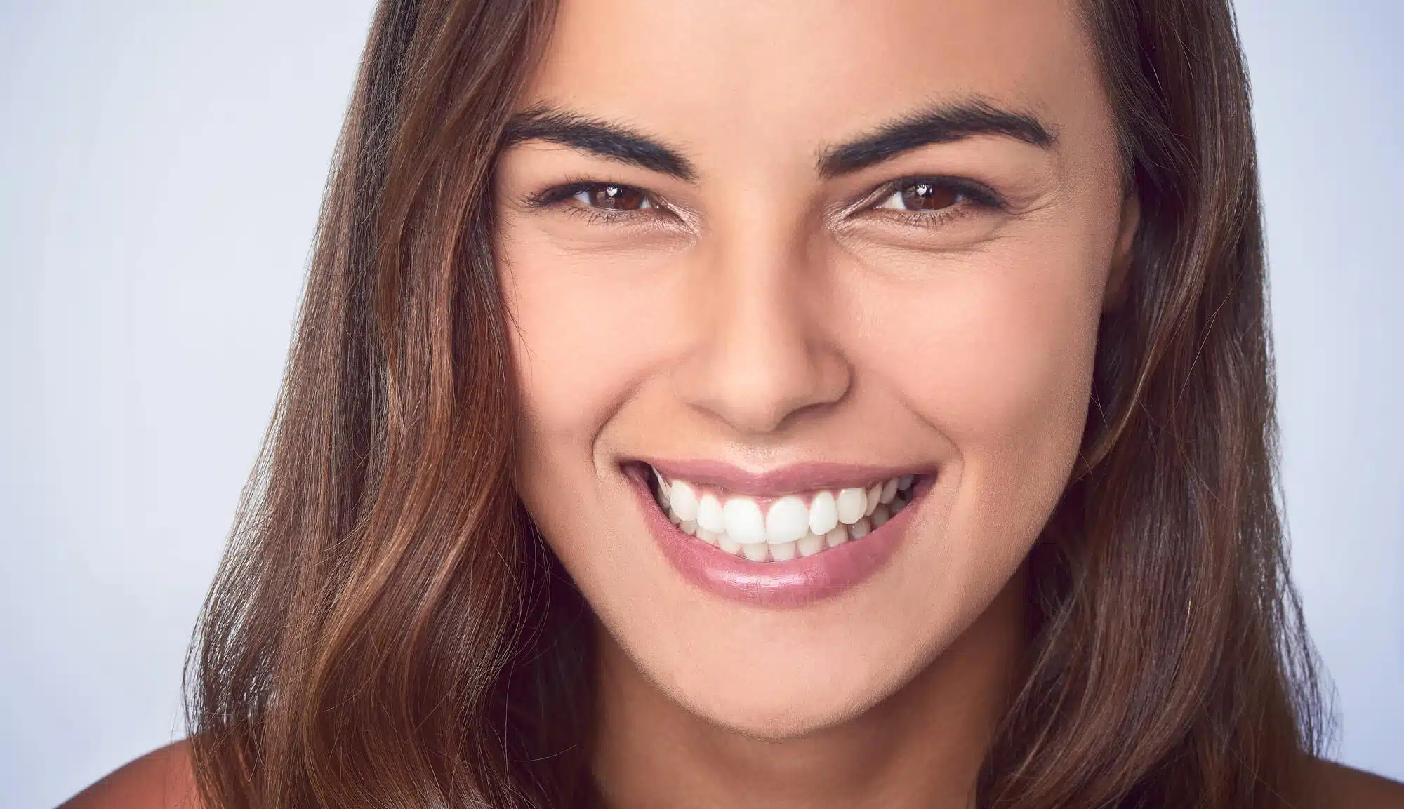 Girl smiling after getting veneers brownstown mi