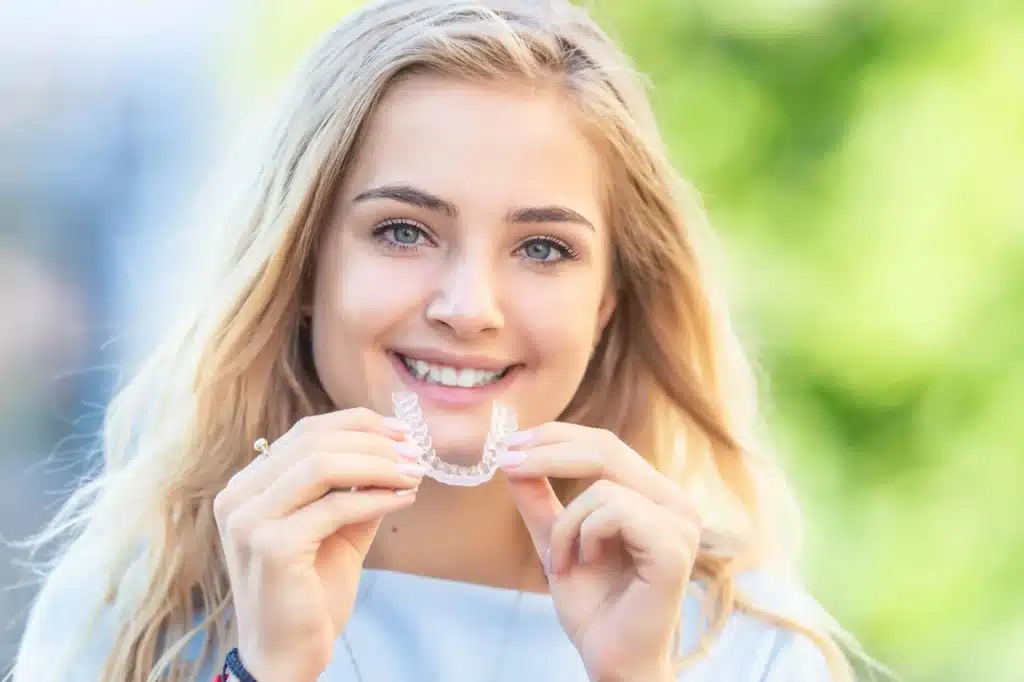 Girl smiling with brownstown invisalign