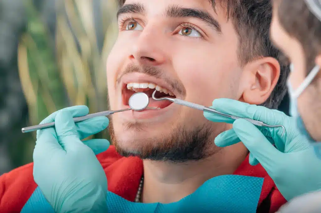 Man undergoing teeth cleaning brownstown mi