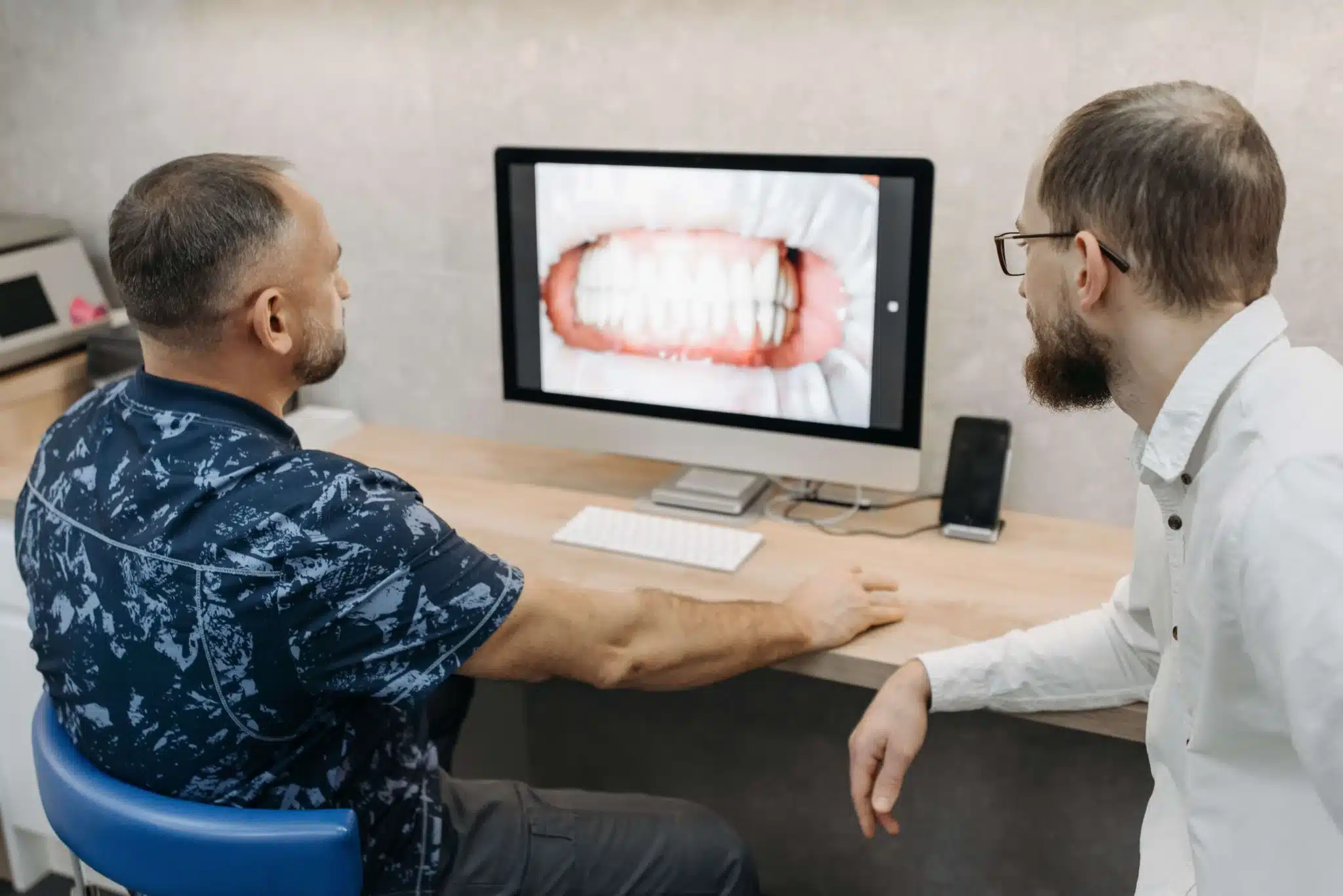 Checking oral cancer screening results at dental office brownstown