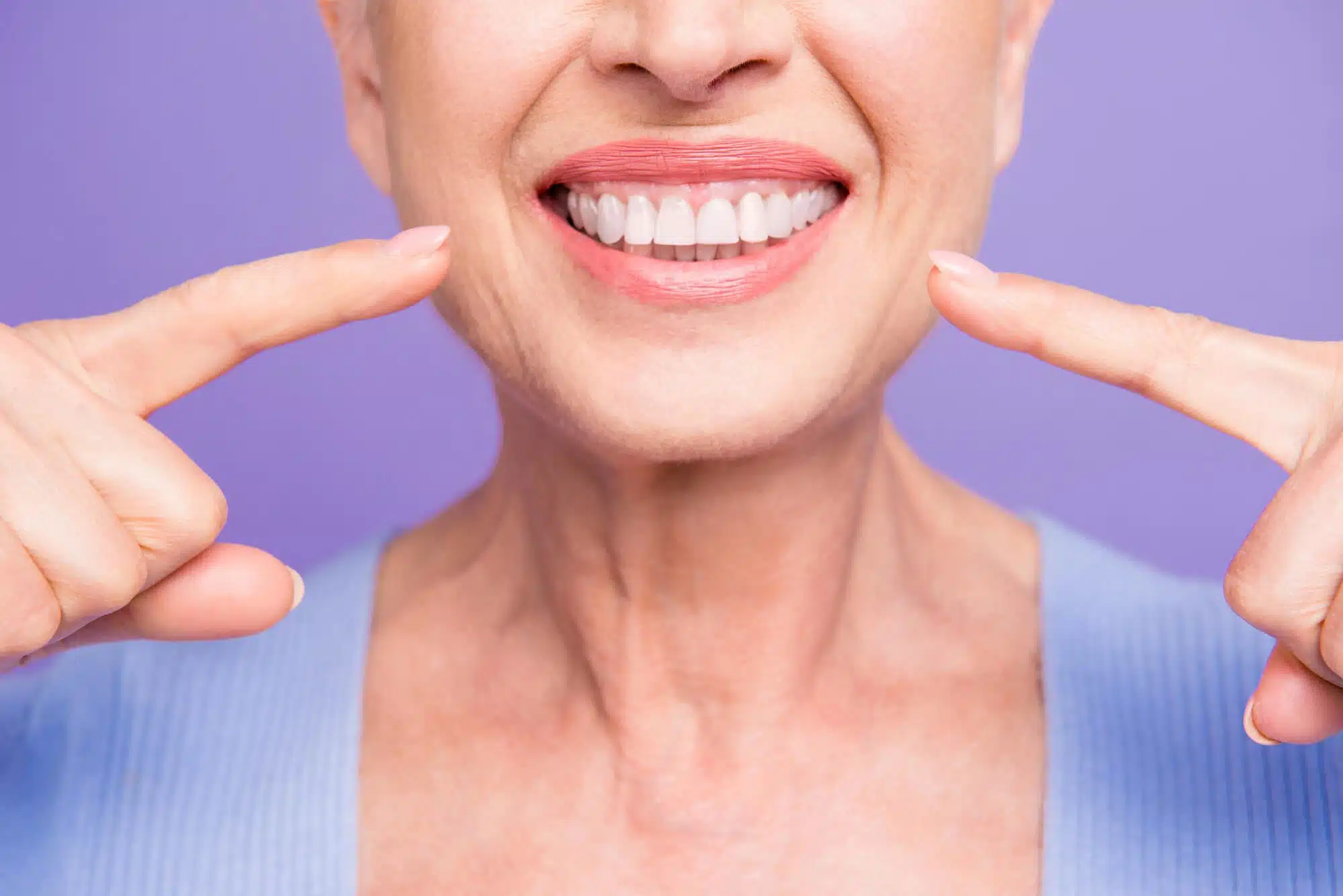 Woman smiling with brownstown dental implants
